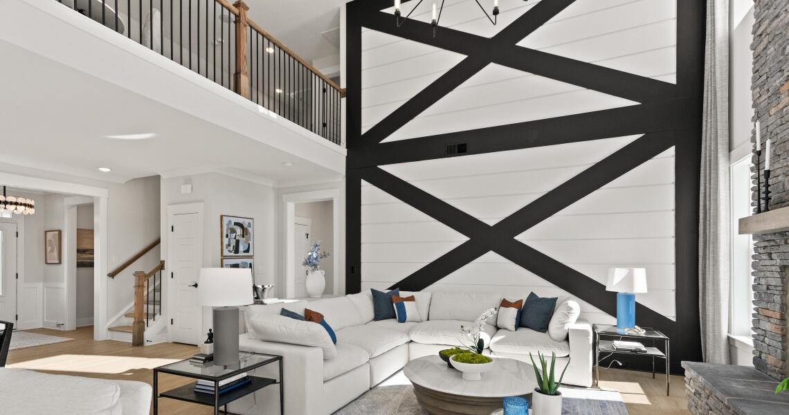 Textured shiplap two-story living room wall