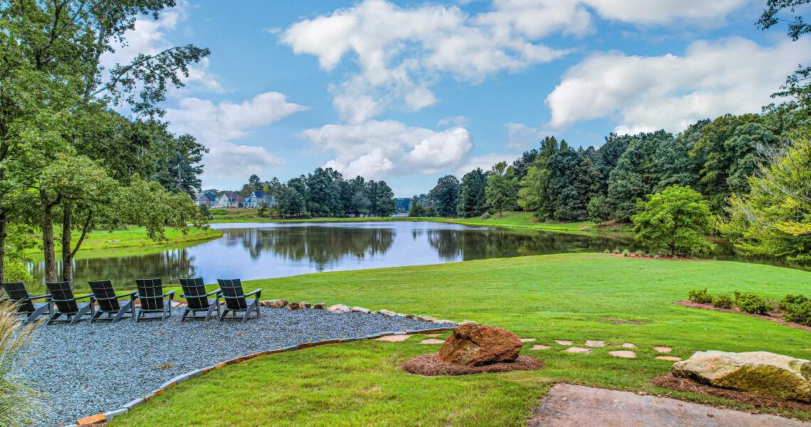 Twin Lakes lakeside outdoor pavilion with Adirondack chairs