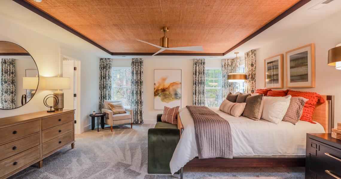 Textured wooden ceiling in primary bedroom