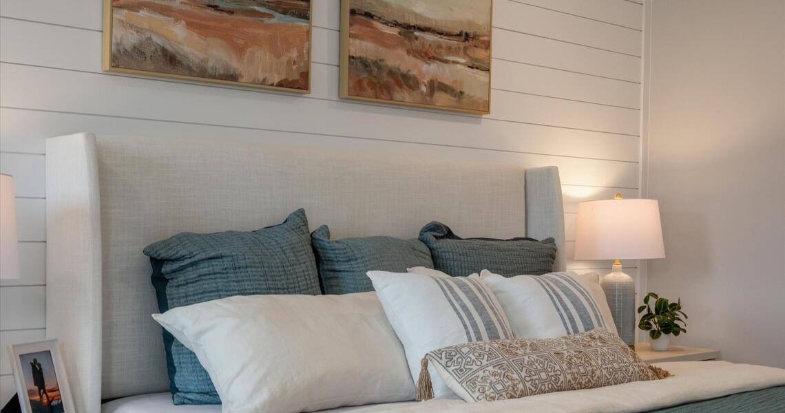Textured shiplap wall in primary bedroom