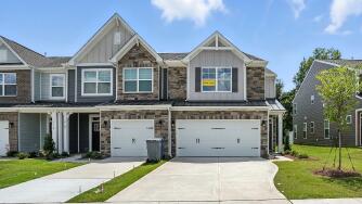 The Southampton 170 front exterior at Harrisburg Village Townhomes